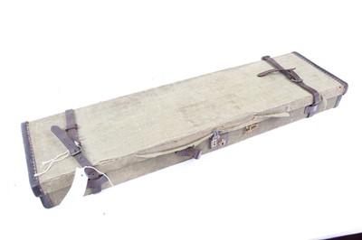 Lot 1466 - Canvas and leather gun case, interior fitted...