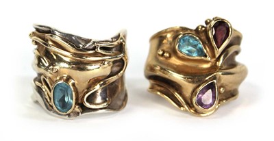 Lot 734 - A yellow metal ring of abstract design set...