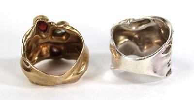 Lot 734 - A yellow metal ring of abstract design set...