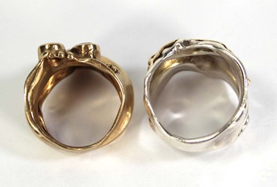 Lot 734 - A yellow metal ring of abstract design set...