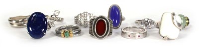 Lot 735 - Eleven silver and metalware dress rings,...
