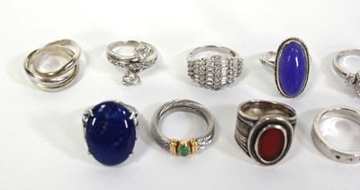 Lot 735 - Eleven silver and metalware dress rings,...