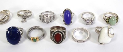 Lot 735 - Eleven silver and metalware dress rings,...