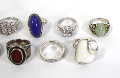 Lot 735 - Eleven silver and metalware dress rings,...