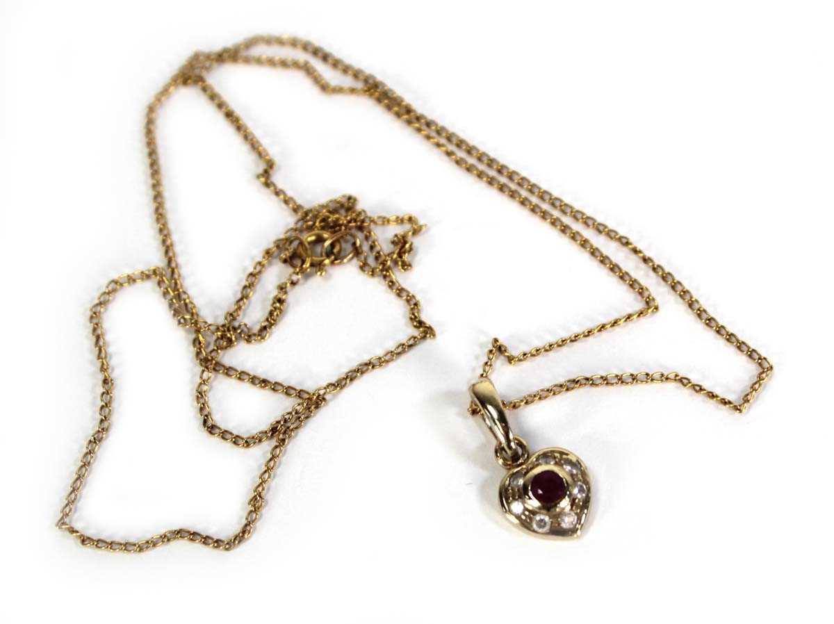 Lot 737 - A 9ct yellow gold finelink necklace suspending...