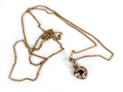 Lot 737 - A 9ct yellow gold finelink necklace suspending...