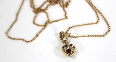 Lot 737 - A 9ct yellow gold finelink necklace suspending...