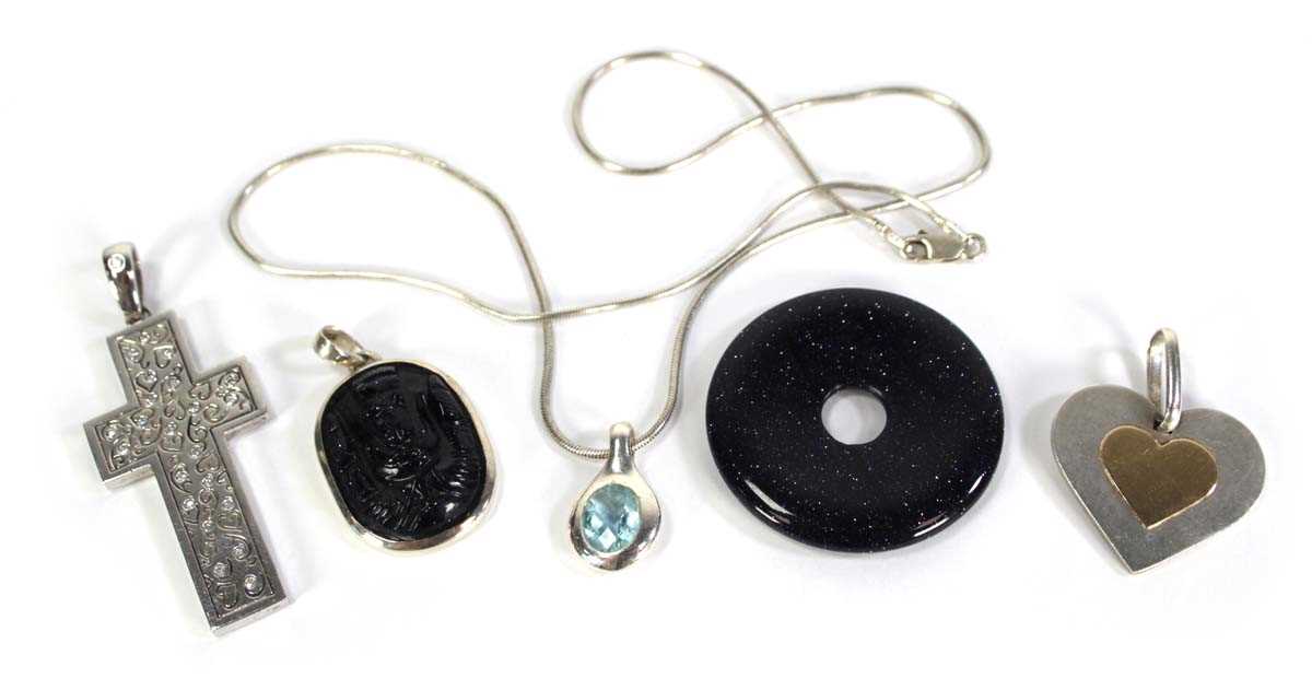 Lot 738 - A silver snakelink necklace suspending a...