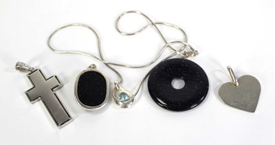 Lot 738 - A silver snakelink necklace suspending a...