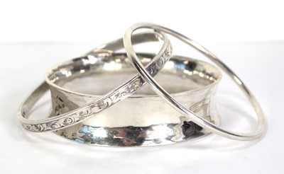 Lot 739 - Three silver bangles including a Charles...