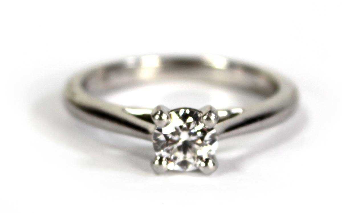 Lot 743 - A platinum ring set brilliant cut diamond in a...