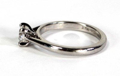 Lot 743 - A platinum ring set brilliant cut diamond in a...