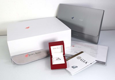 Lot 743 - A platinum ring set brilliant cut diamond in a...