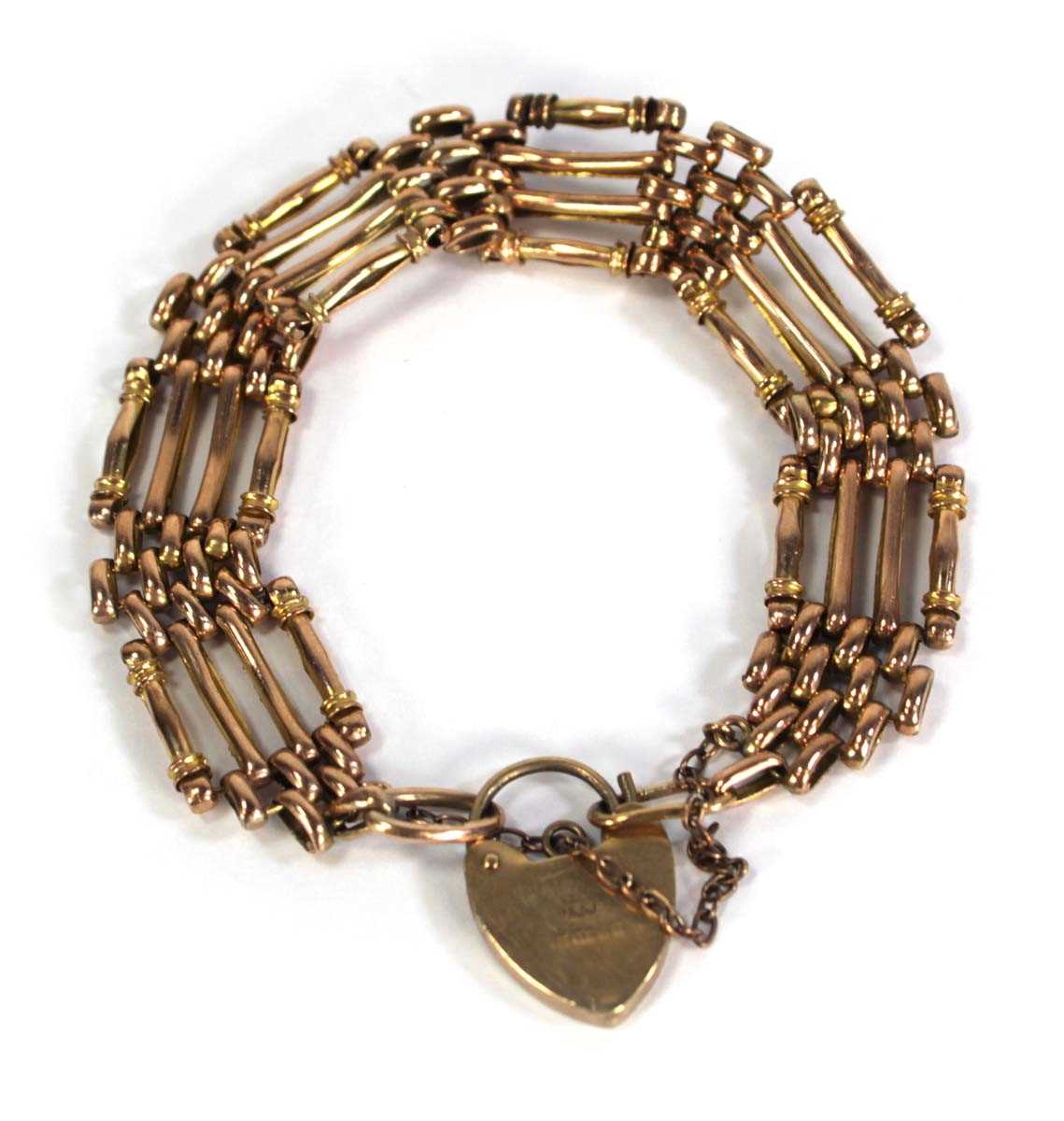 Lot 744 - A 9ct yellow gold four bar gatelink bracelet...