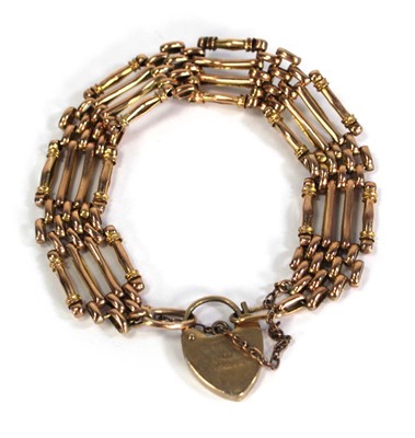 Lot 744 - A 9ct yellow gold four bar gatelink bracelet...
