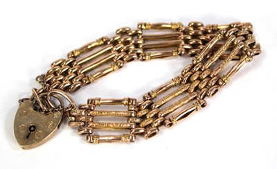 Lot 744 - A 9ct yellow gold four bar gatelink bracelet...