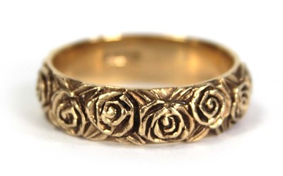 Lot 747 - A 9ct yellow gold band ring partially...