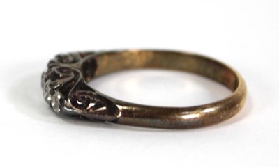 Lot 748 - An 18ct yellow gold ring set five small...