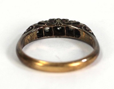Lot 748 - An 18ct yellow gold ring set five small...