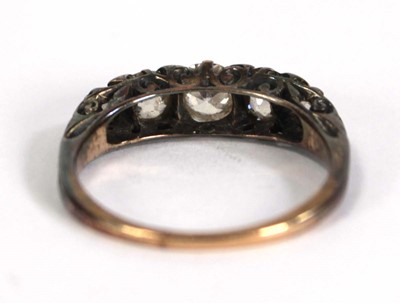 Lot 749 - An 18ct yellow gold ring set five small...