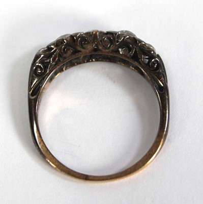 Lot 749 - An 18ct yellow gold ring set five small...