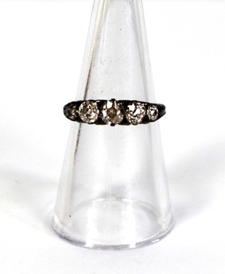 Lot 749 - An 18ct yellow gold ring set five small...