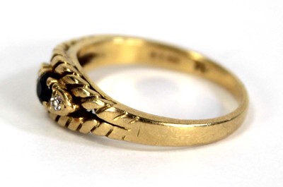 Lot 750 - An 18ct yellow gold ring set small sapphire...