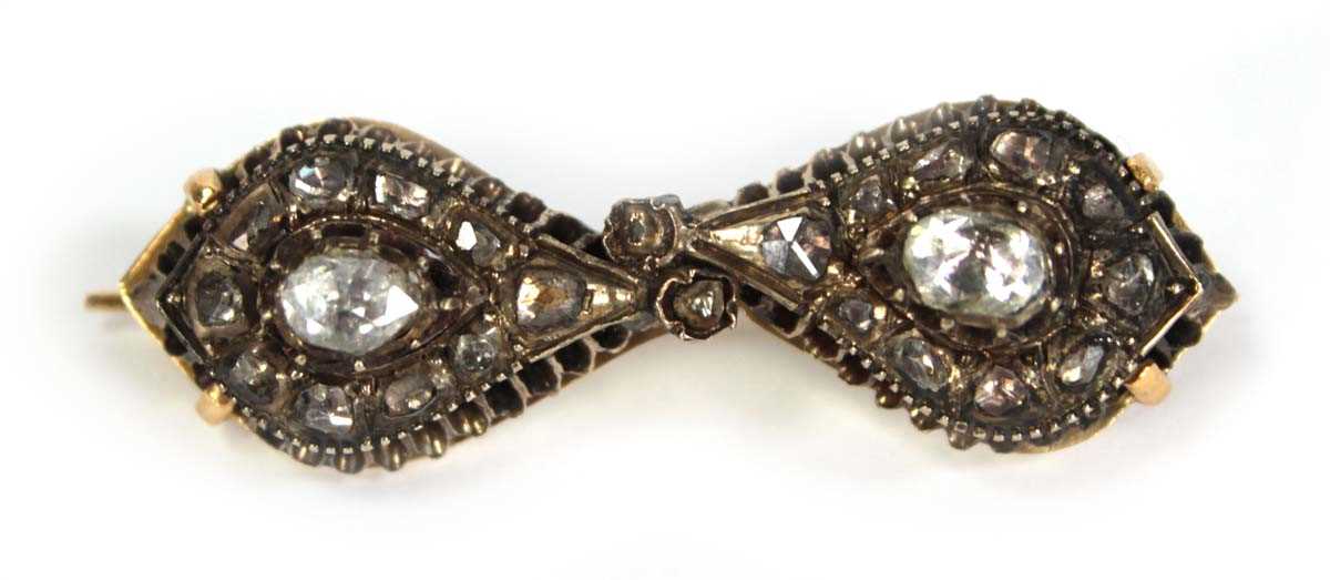 Lot 754 - An 18ct yellow gold brooch constructed from a...