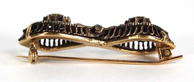 Lot 754 - An 18ct yellow gold brooch constructed from a...