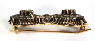 Lot 754 - An 18ct yellow gold brooch constructed from a...