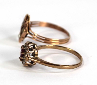 Lot 759 - A 9ct yellow gold cluster ring set small ruby...