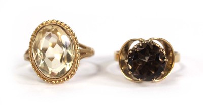 Lot 760 - A 9ct yellow gold ring set smoky quartz, ring...