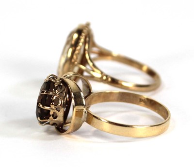 Lot 760 - A 9ct yellow gold ring set smoky quartz, ring...