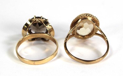 Lot 760 - A 9ct yellow gold ring set smoky quartz, ring...