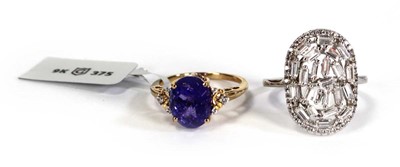 Lot 761 - A 9ct yellow gold ring set tanzanite coloured...