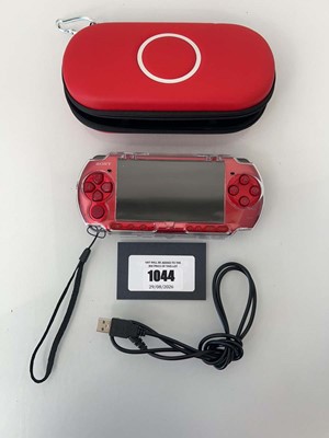 Lot 1044 - Sony PSP in Red with case and charging cable