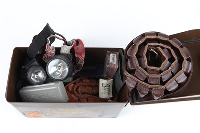 Lot 1128 - Ammunition tin containing cartridge belts, hip...