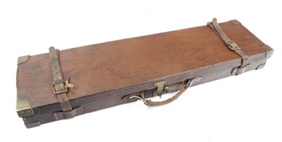 Lot 1469 - A brown leather gun case with brass corners,...