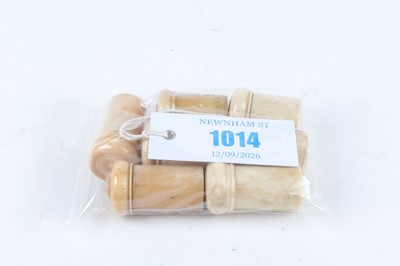Lot 1014 - Seven bone pots containing strikers