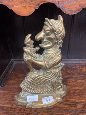 Lot 59 - A brass Punch & Judy door stop