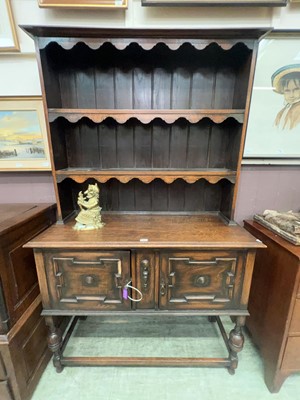 Lot 60 - An oak dresser of two cupboards over...