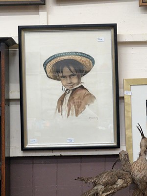 Lot 63 - A framed limited edition print of a boy in a...