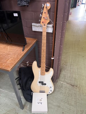 Lot 9 - Squier by Fender four string bass guitar with...