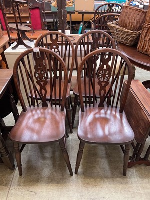 Lot 98 - A set of four wheelback oak chairs