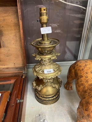 Lot 308 - An ornate brass oil lamp converted to...