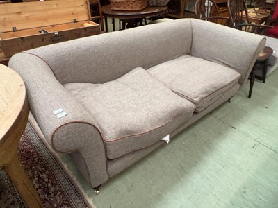 Lot 140 - Oatmeal upholstered large two-seater sofa