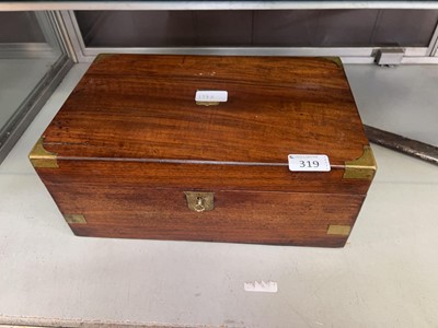 Lot 319 - A mahogany and brass mounted writing slope