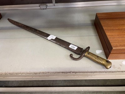 Lot 320 - An early 20th century bayonet in sheath