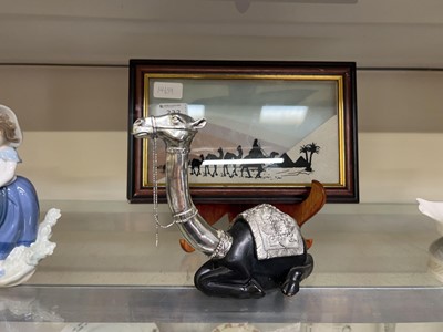 Lot 333 - A moulded model of a camel along with a framed...