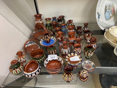 Lot 337 - An assortment of small slipware items to...